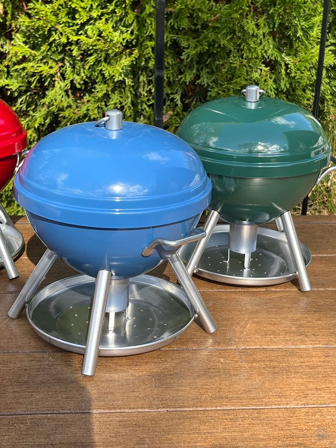 2 BBQ shaped Birdfeeders against a greenery background