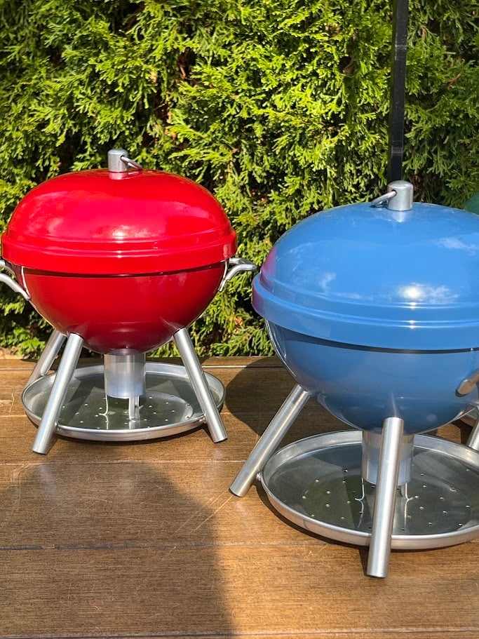 2 BBQ shaped Birdfeeders against a greenery background