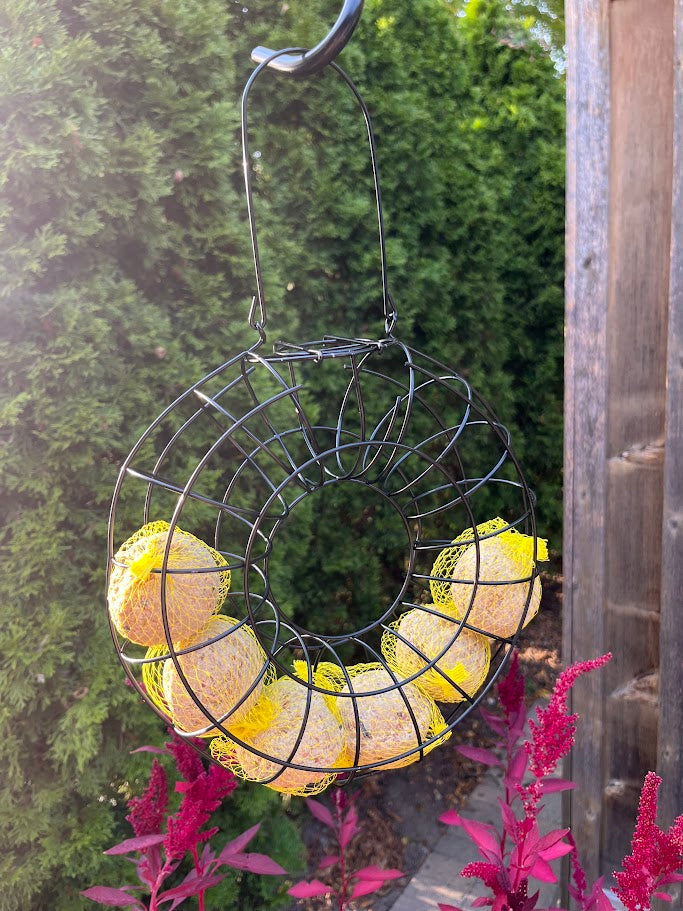 Decorative wreath with yellow lights hanging outdoors