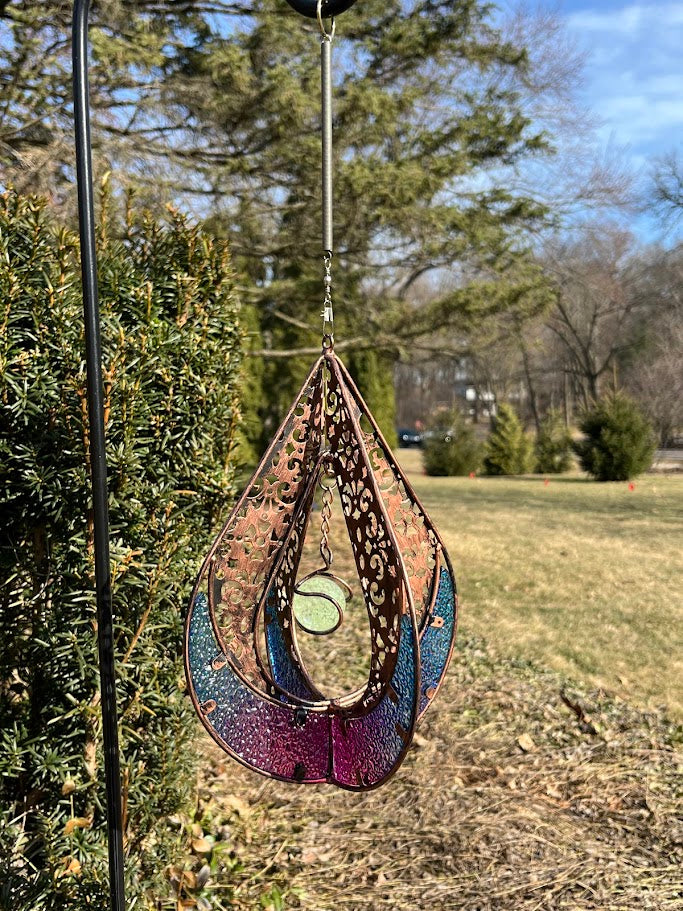 Decorative hanging item with intricate patterns and colors on a natural background